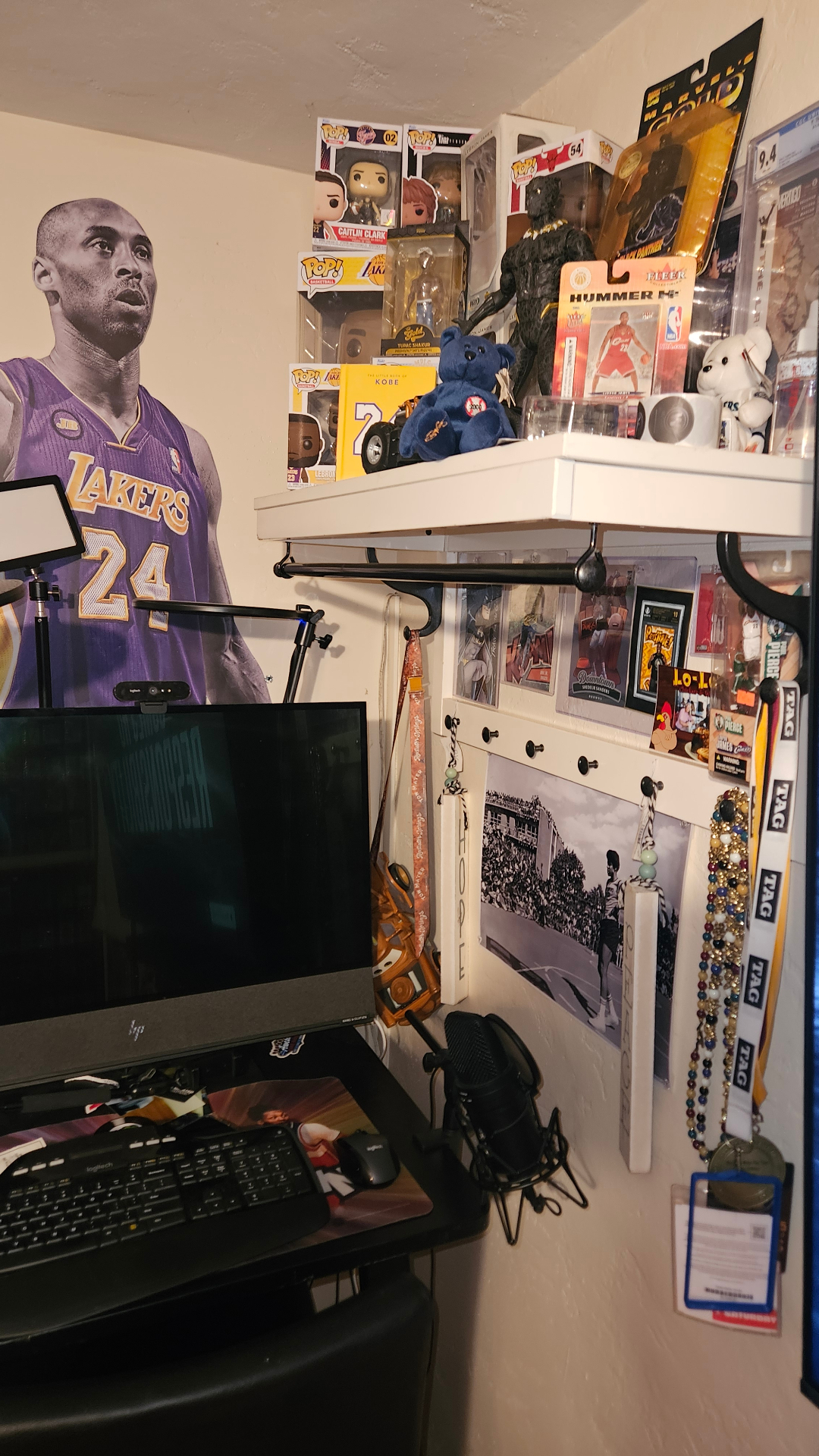 Desk corner with memorabilia and graded cards.